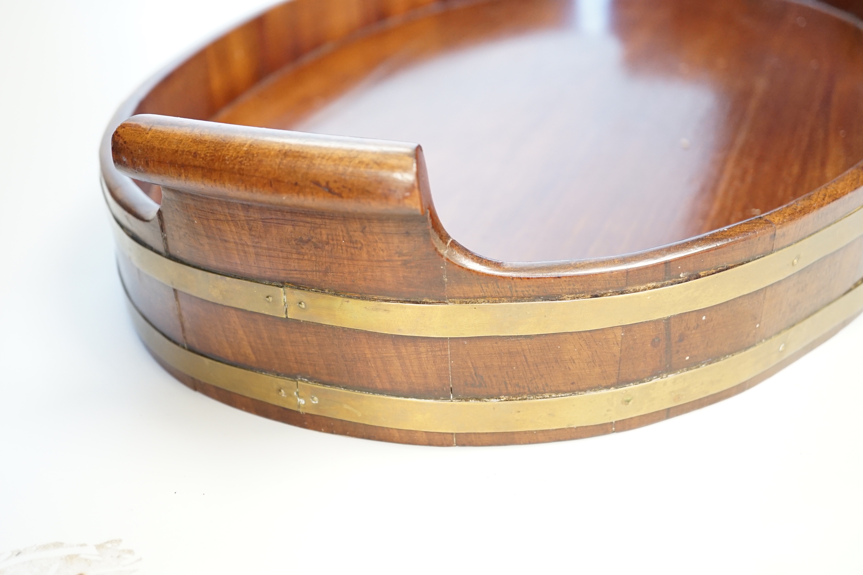 A late Georgian brass-bound mahogany tray, 58cm wide